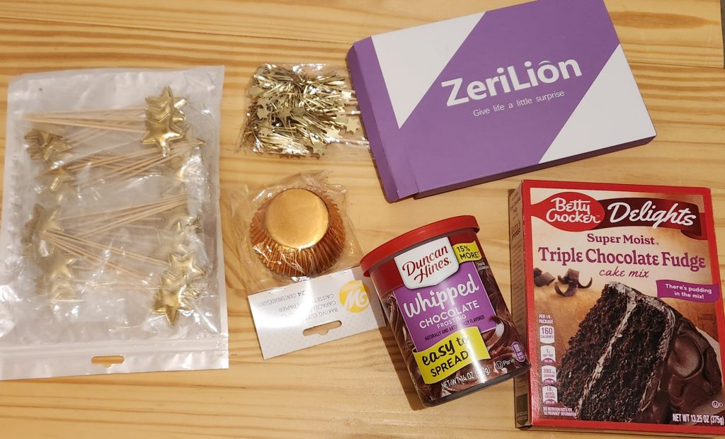 Star cupcake toppers, firework cupcake toppers, gold cupcake baking cups, chocolate icing, chocolate cake mix